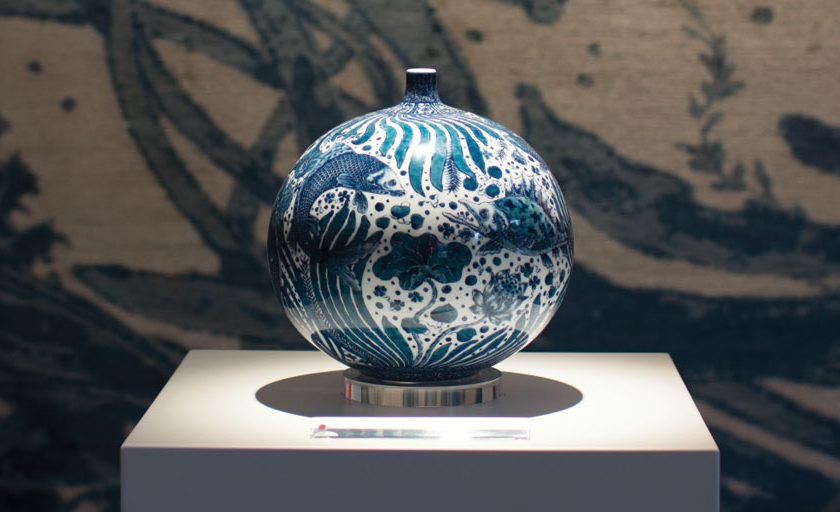 Vase with Fish and Aquatic Plants Motif by Yuki Hayama shown against 'Sea Tangle' by Joseph Carini Carpets. - The Ruggist | Image courtesy of Joseph Carini Carpets