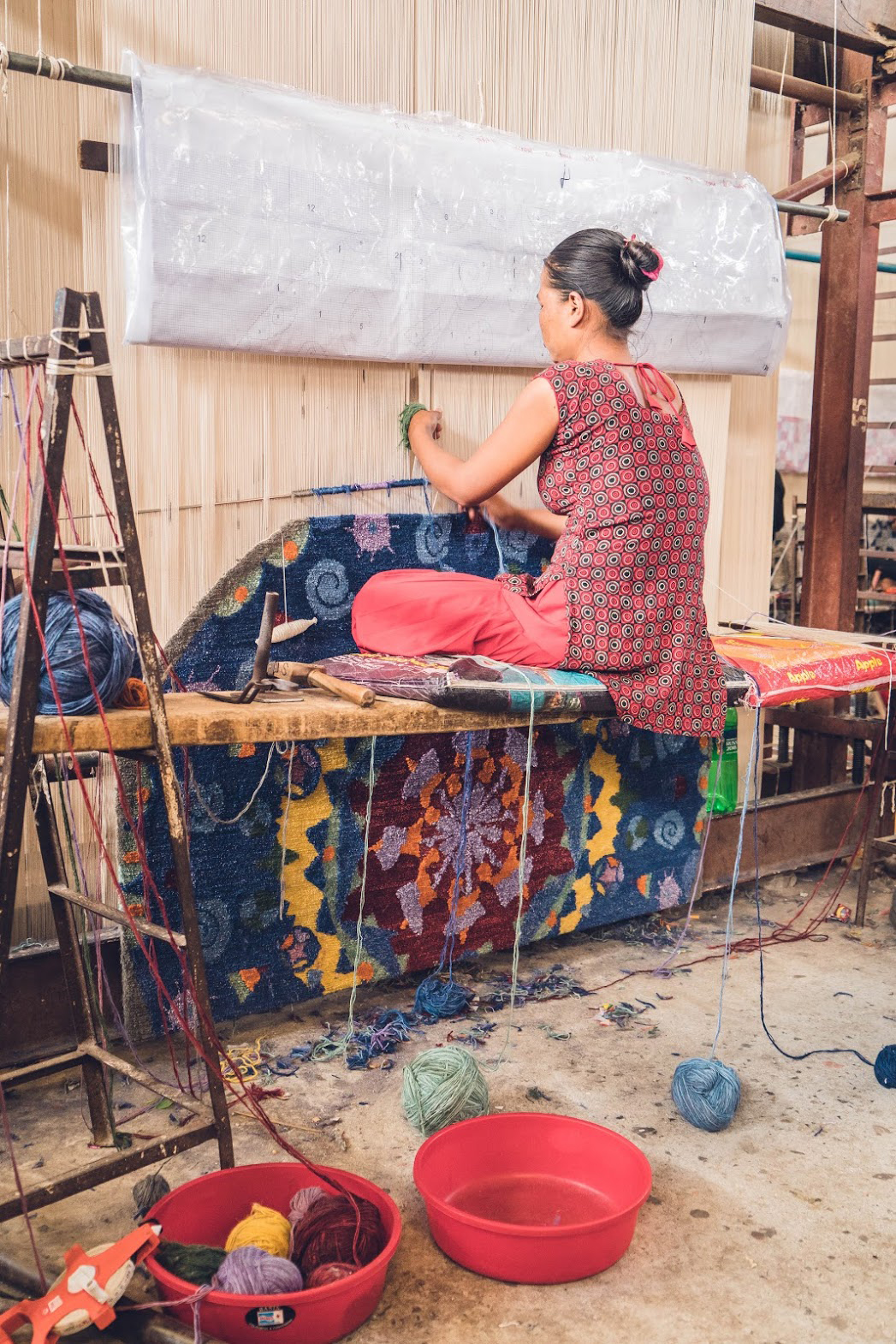 One of the rugs designed as part of the Crossroads and Avenues project launched by Kyle and Kath - Jan Kath Design is shown here on loom in Kathmandu, Nepal. | Image courtesy fo Kyle and Kath.