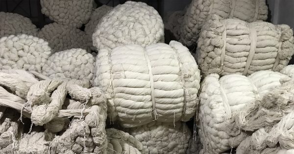 Materials Matter, Bailed hanks of undyed wool at Khantze & Co. in Kathmandu await dying and then knotting into fine handmade Nepali-Tibetan carpets. | Photograph by The Ruggist.