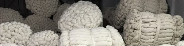 Materials Matter, Bailed hanks of undyed wool at Khantze & Co. in Kathmandu await dying and then knotting into fine handmade Nepali-Tibetan carpets. | Photograph by The Ruggist.